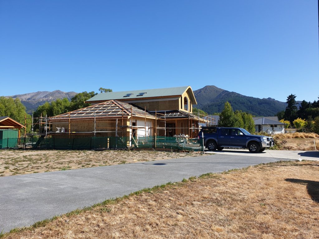 Curved corrugated iron roof installation in Hanmer Springs
